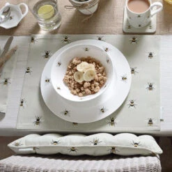 Bees Chair Pad -Sophie Allport bees collection table lifestyle high res 3 web image cdbdbe9a 58ca 4223 8c2c c8cc4650b54b
