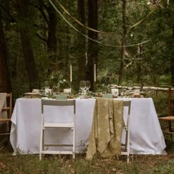 Hedgehogs Wool Knitted Throw -Sophie Allport hedgehog and parkland trees table setting outdoors 2 lifestyle high res square