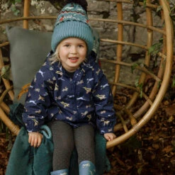 Running Dogs Raincoat -Sophie Allport kh86k rc8634 puwbk867 running dogs knitted kids hat raincoat and wellington boots lifestyle high res square