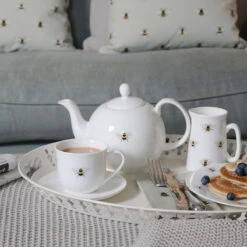Bees Teapot -Sophie Allport tc3601 bees small teacup and saucer lifestyle high res web image square